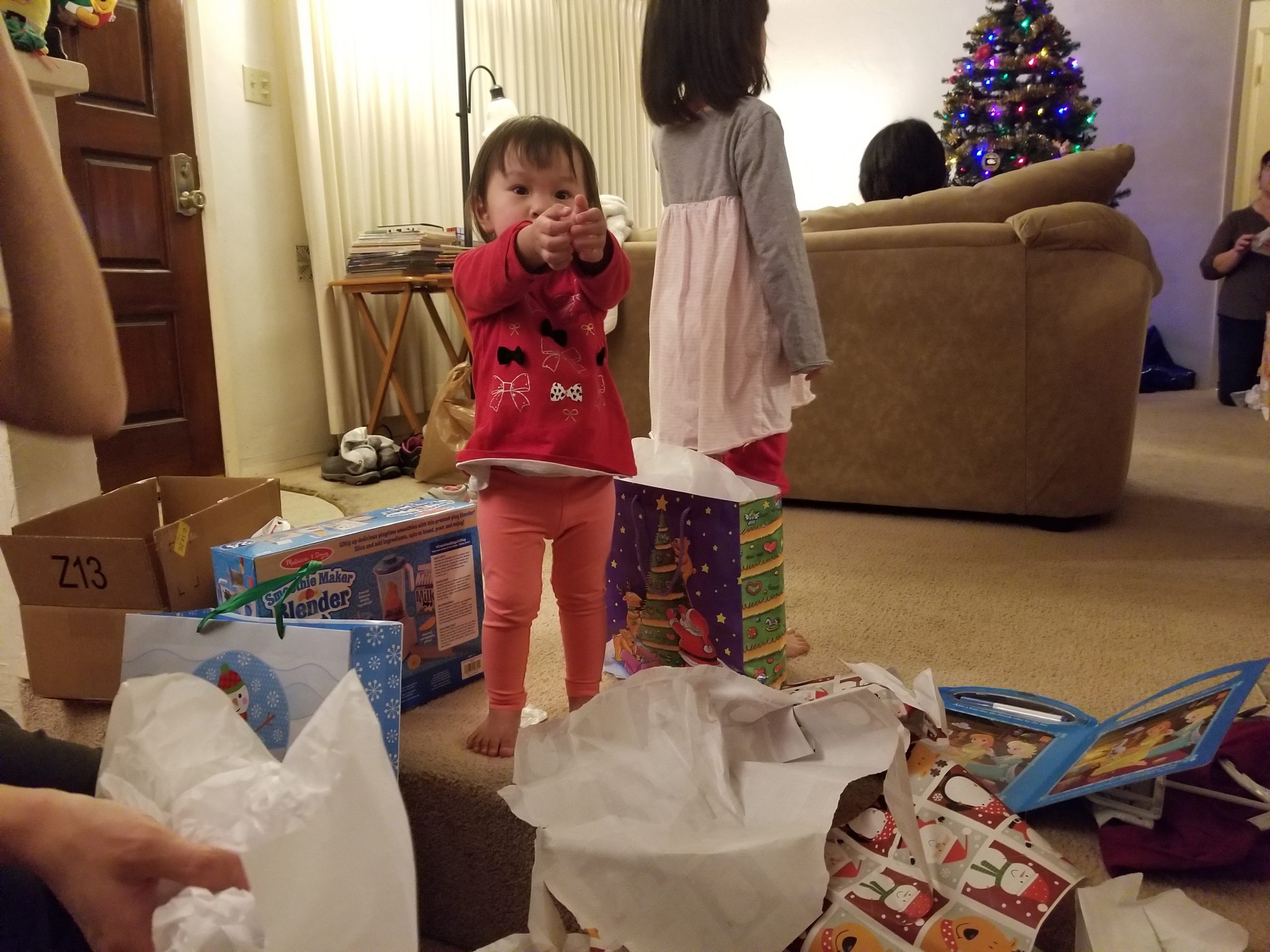 Helping sister open presents