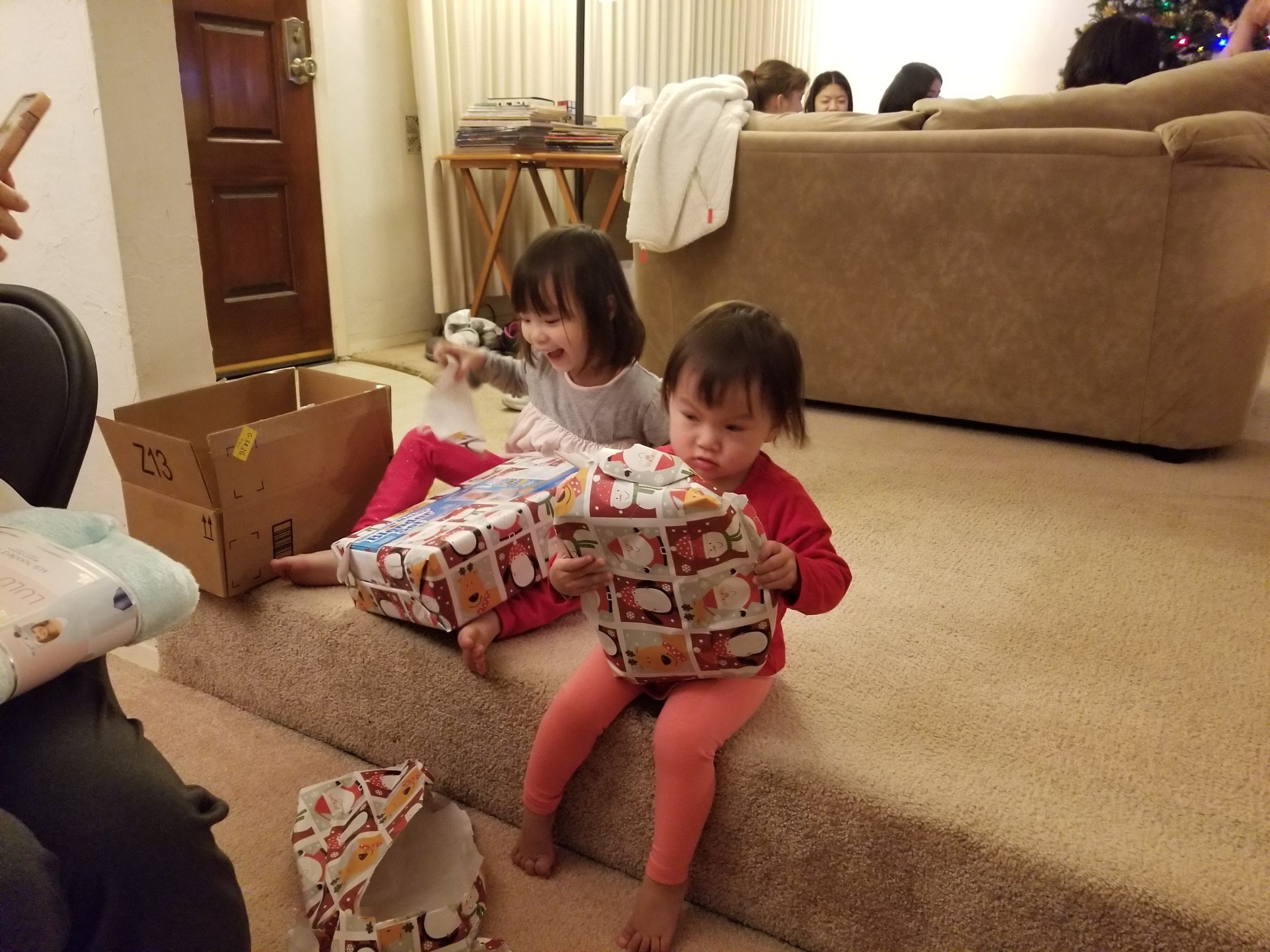 Helping my sister open presents